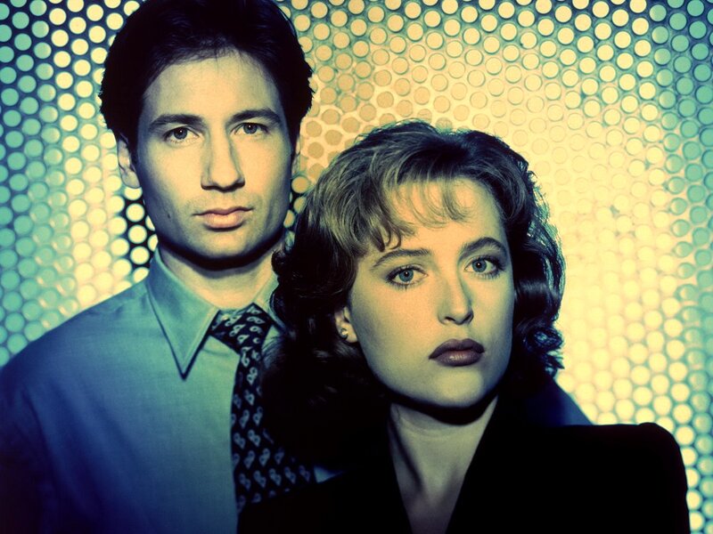 Man and Woman in Front of Patterned Wall
