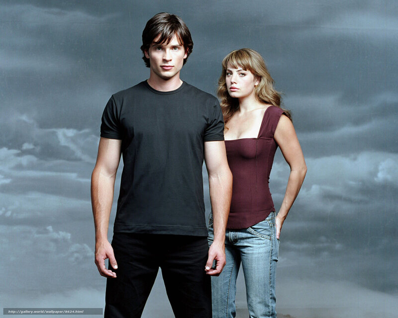 man and woman in front of stormy sky