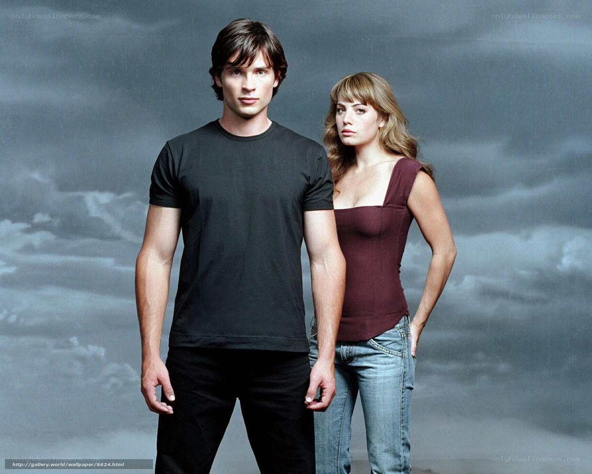 man and woman in front of stormy sky