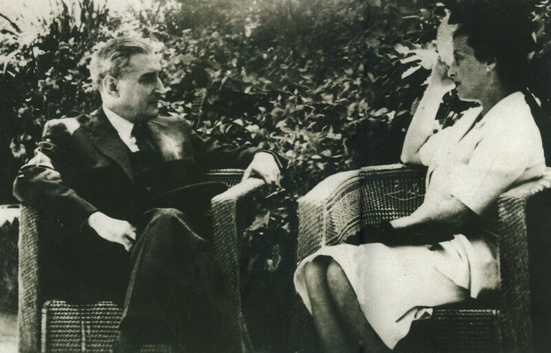 man and woman in garden conversation