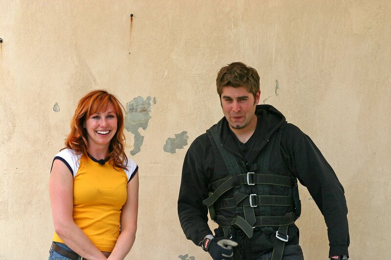Man and woman in harnesses