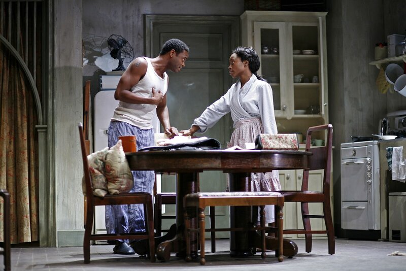 Man and Woman in Kitchen — Brown