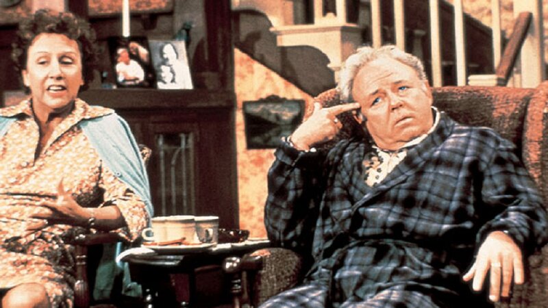 Man and Woman in Living Room — Brown