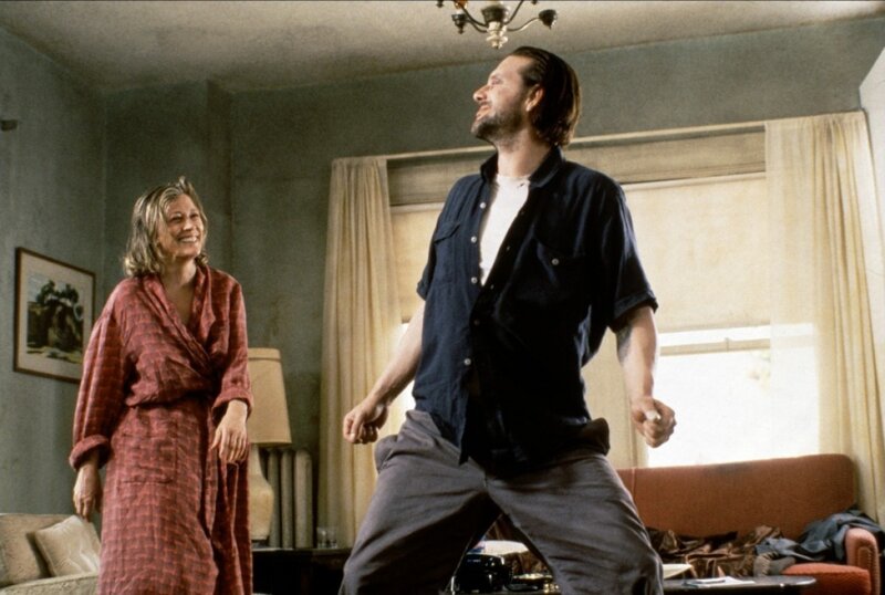 Man and Woman in Living Room — Gray