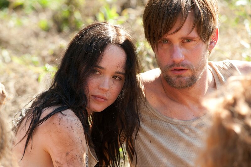 man and woman in muddy field