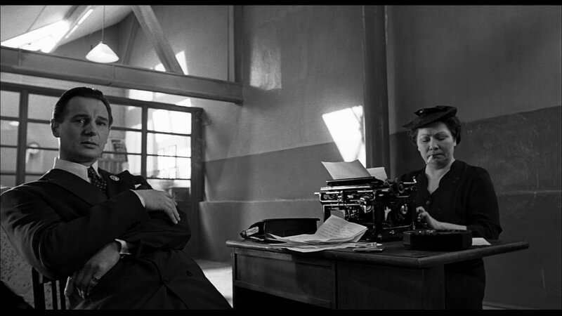 Man and woman in office scene