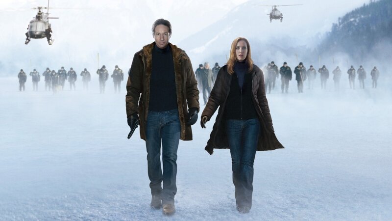 Man and woman in snowy field