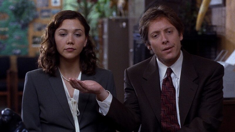 Man and Woman in Suits — Brown, Serious