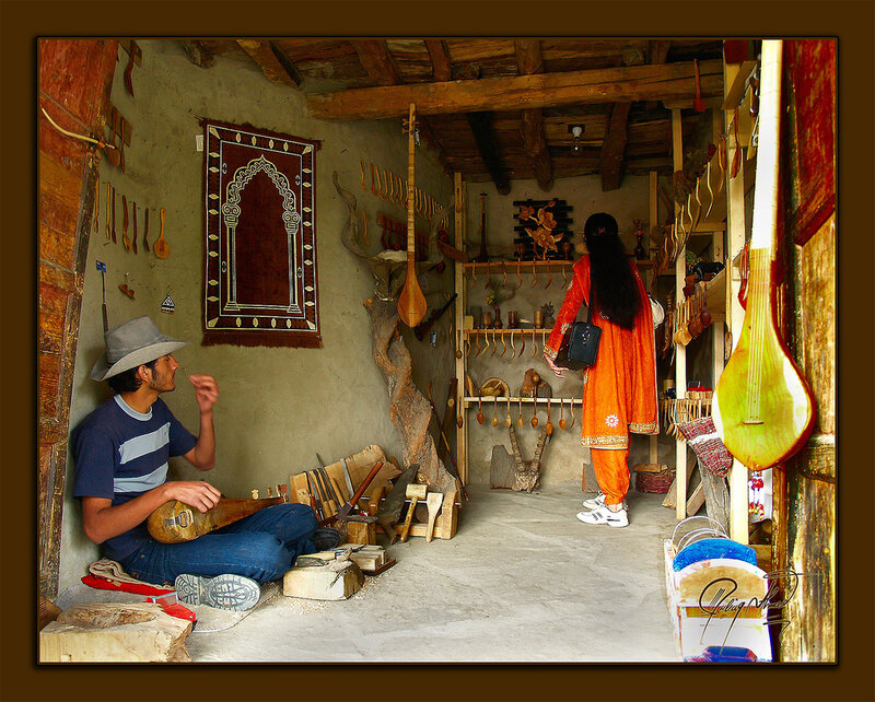 Man and Woman in Workshop — Brown