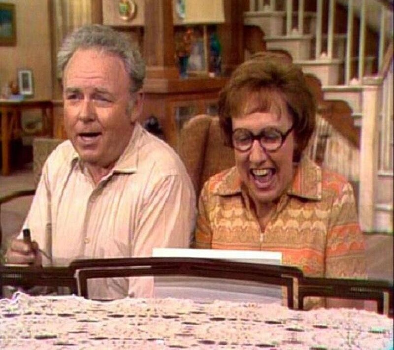 man and woman laughing at table