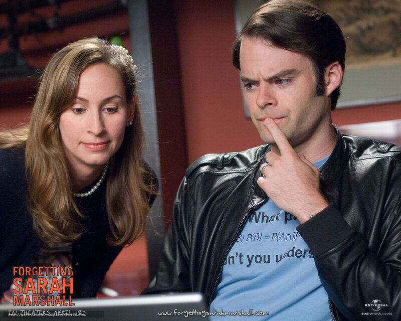 Man and Woman Looking at Laptop
