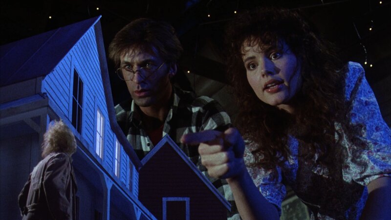 Man and Woman Looking at Model House