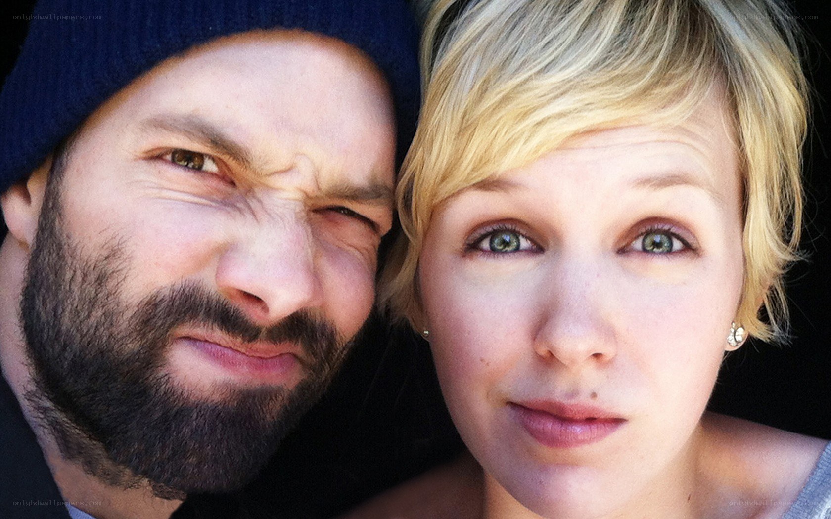 man and woman making faces