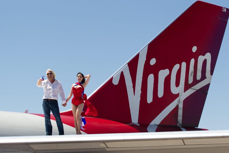 Man and Woman on Airplane — Red