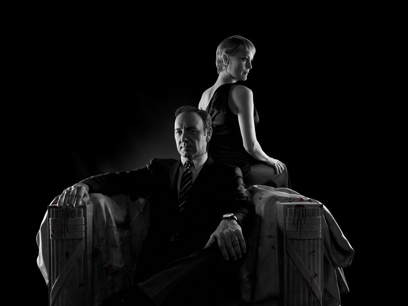 Man and woman on blood-stained throne