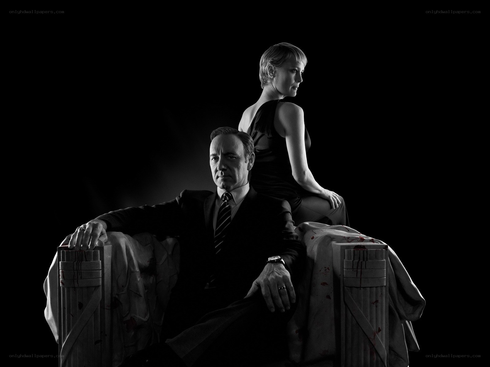 Man and woman on blood-stained throne