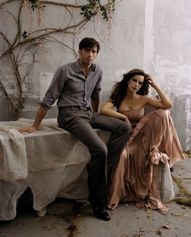 Man and woman on draped bench