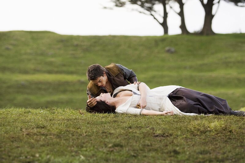 Man and woman on grassy field