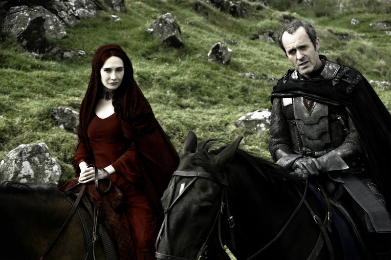 Man and woman on horseback