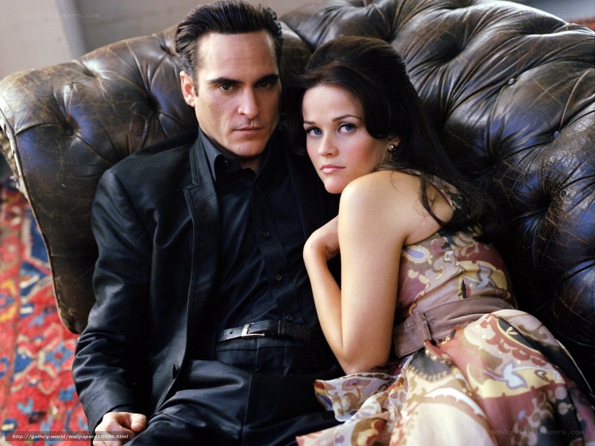 Man and woman on leather couch
