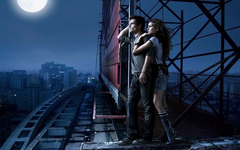 Man and Woman on Rooftop — Blue