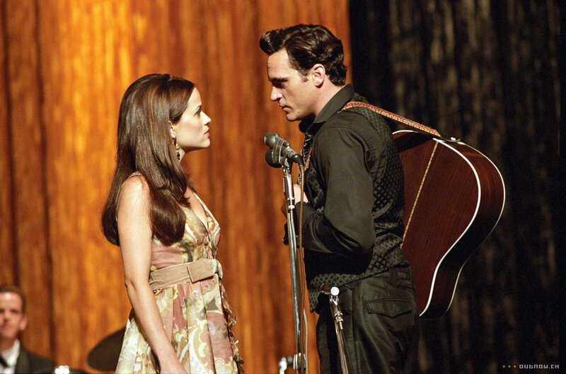 Man and Woman on Stage — Brown