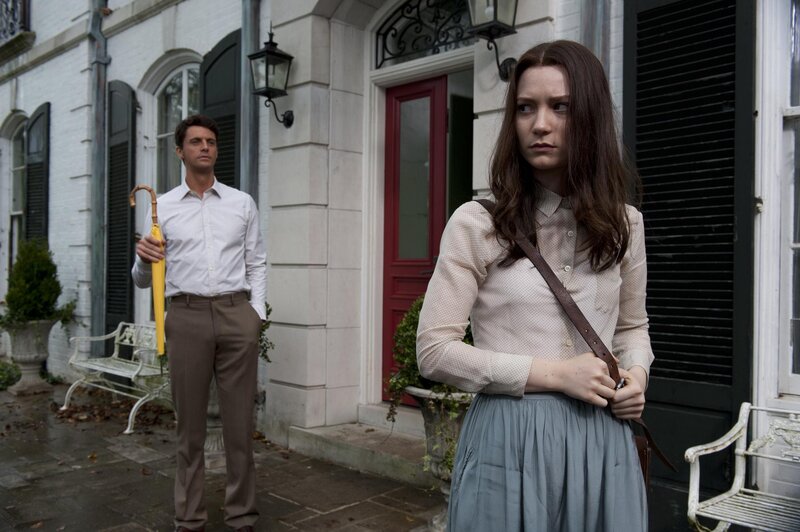 Man and woman outside house