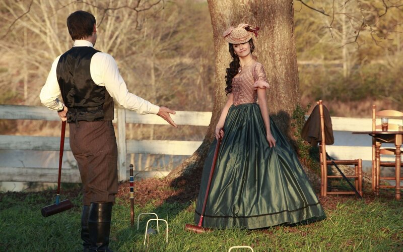 Man and Woman Playing Croquet