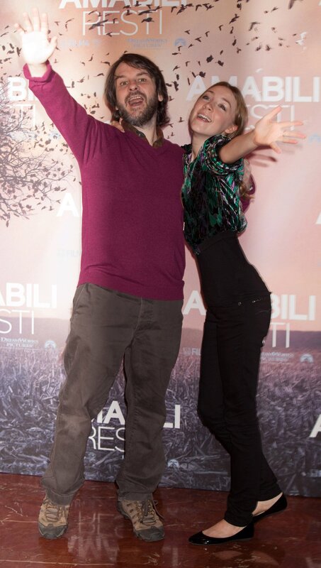 Man and woman posing at event