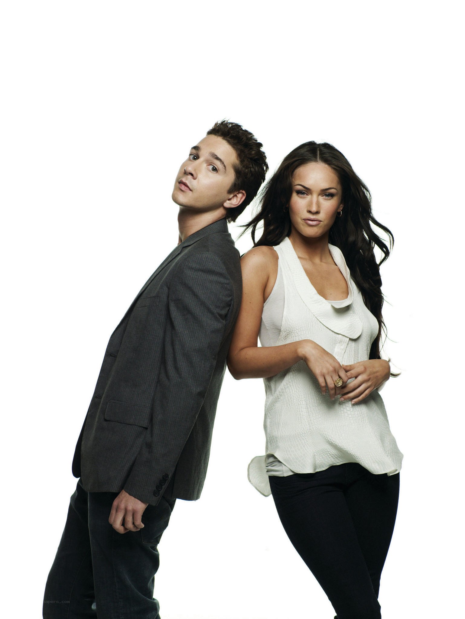 man and woman posing back to back