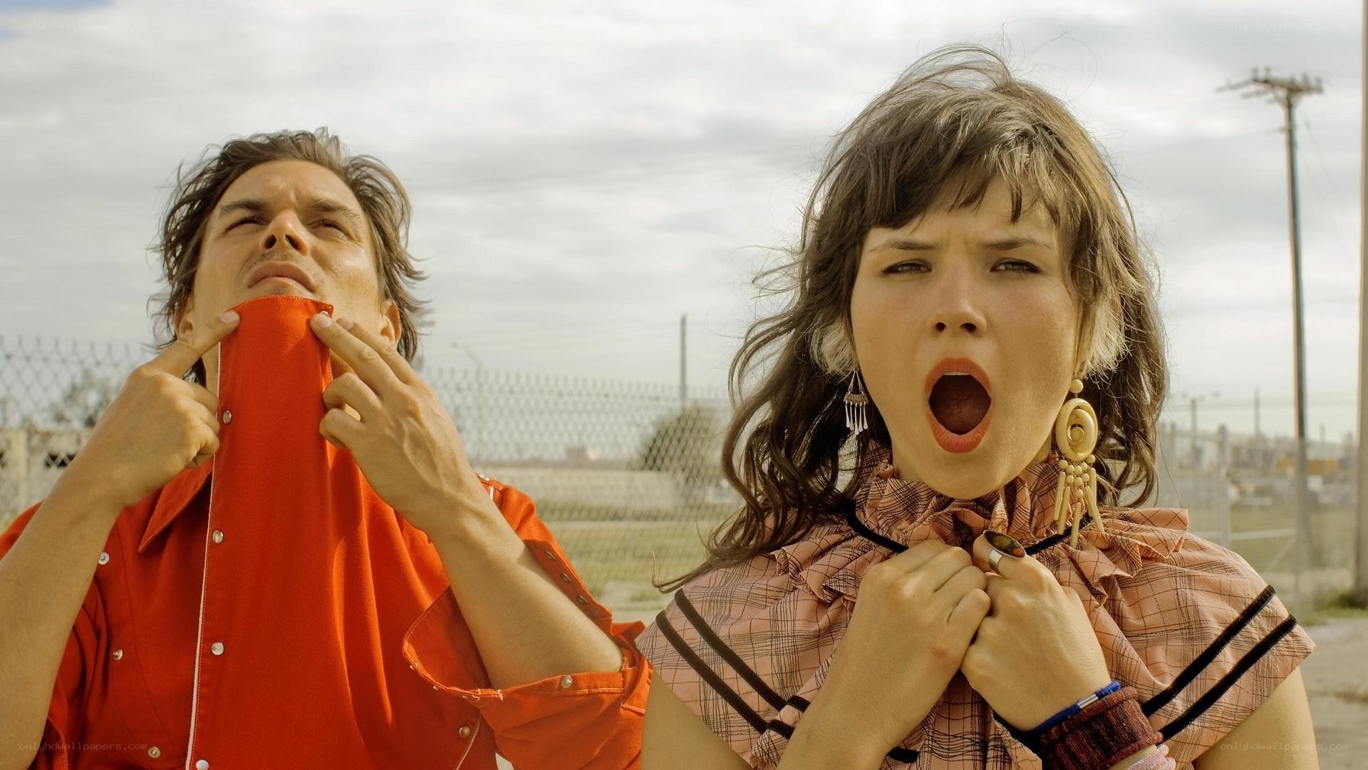 Man and woman pulling collars