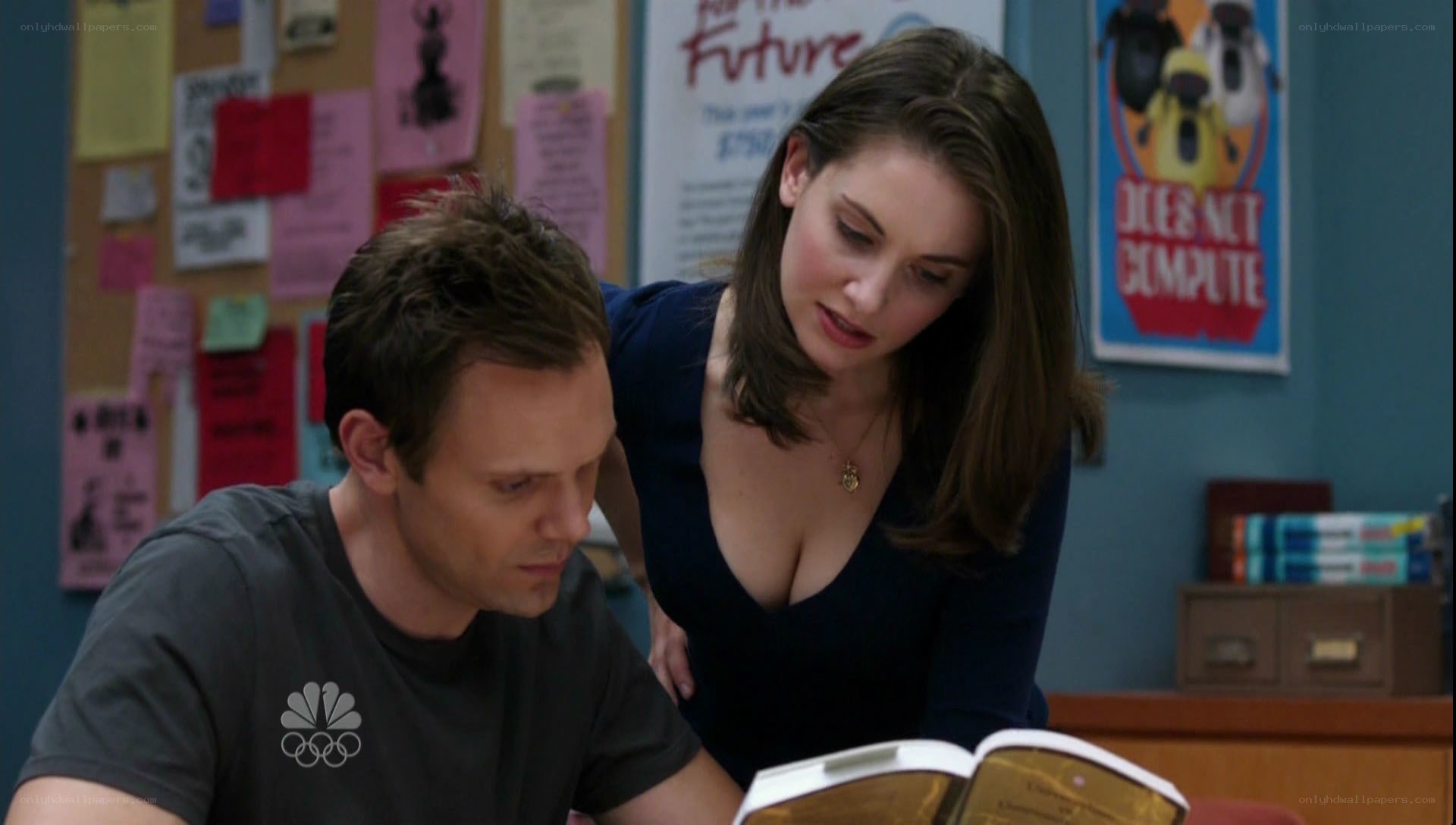 man and woman reading together