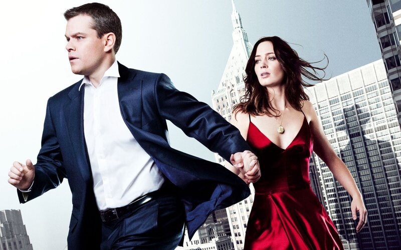 Man and woman running in city