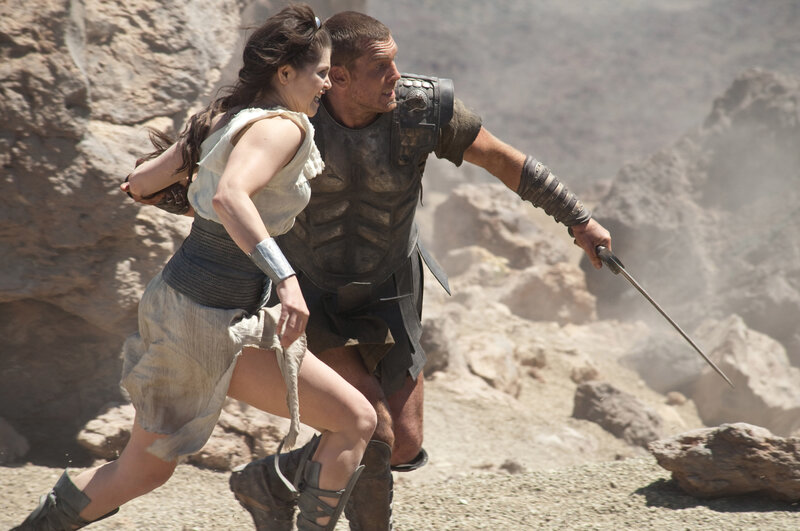 man and woman running in desert