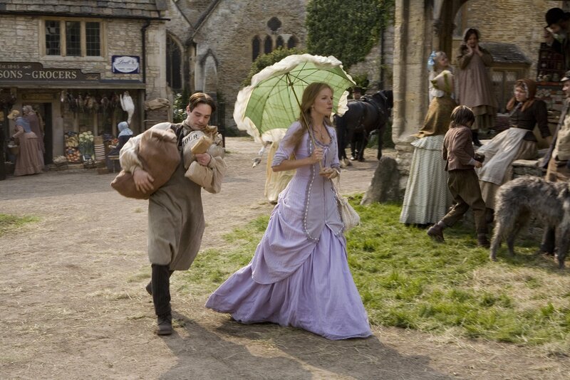 Man and woman running in town