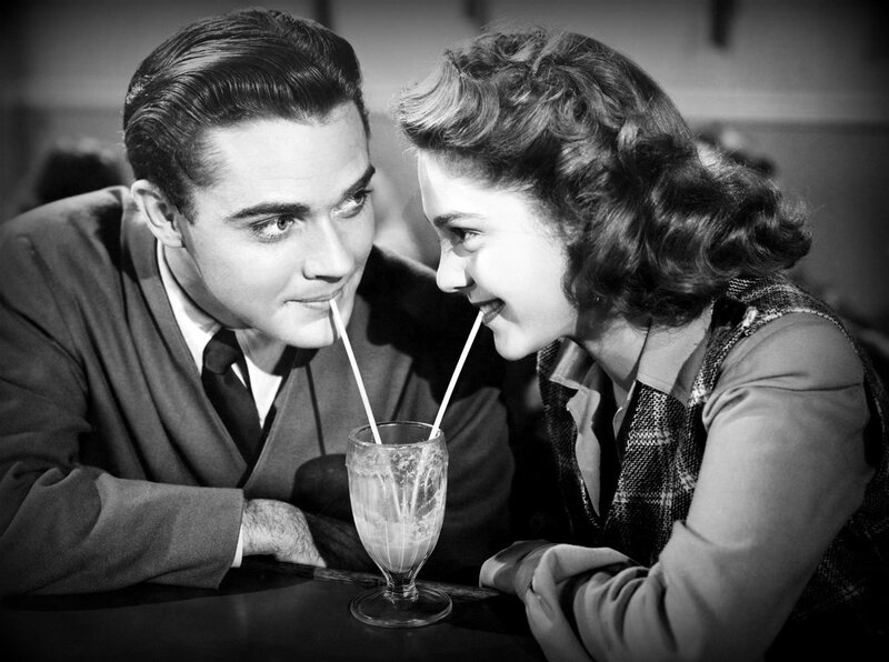 Man and Woman Sharing Drink