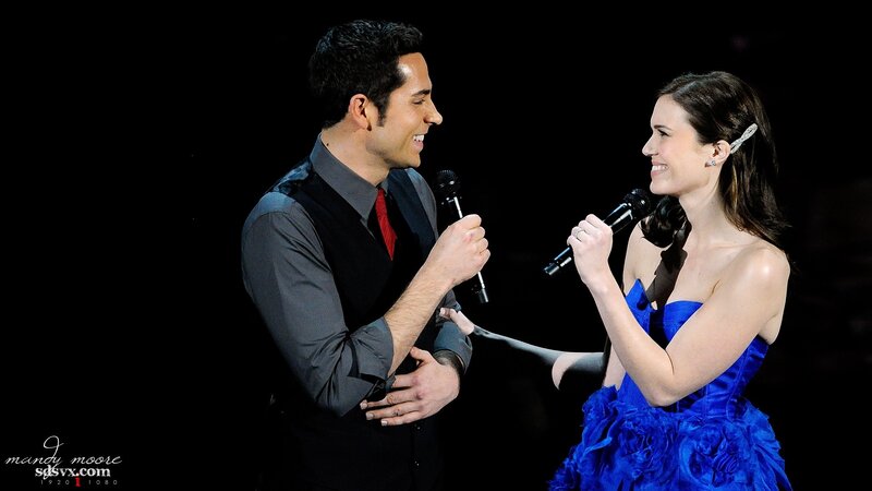 Man and woman singing on stage