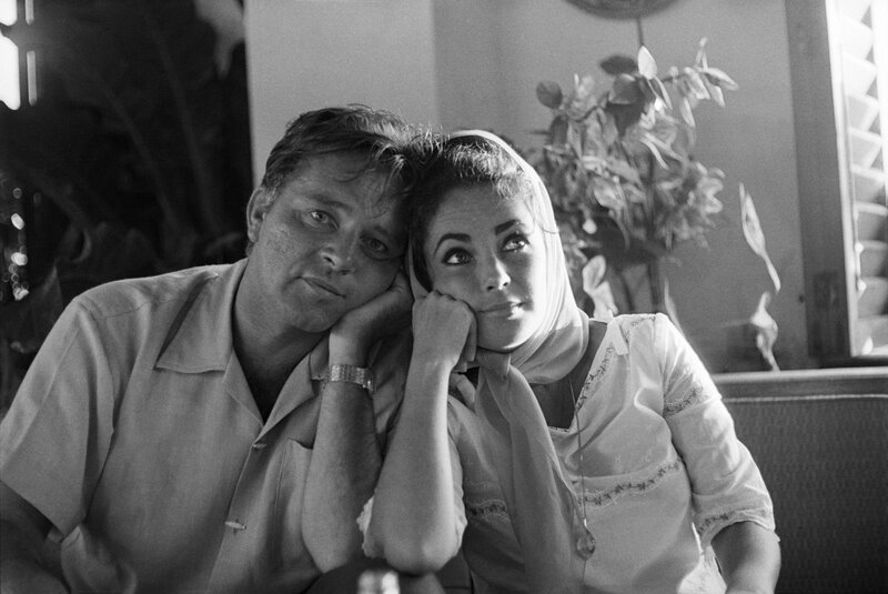 Man and Woman Sitting — Black, Intimate, Photograph, Plant