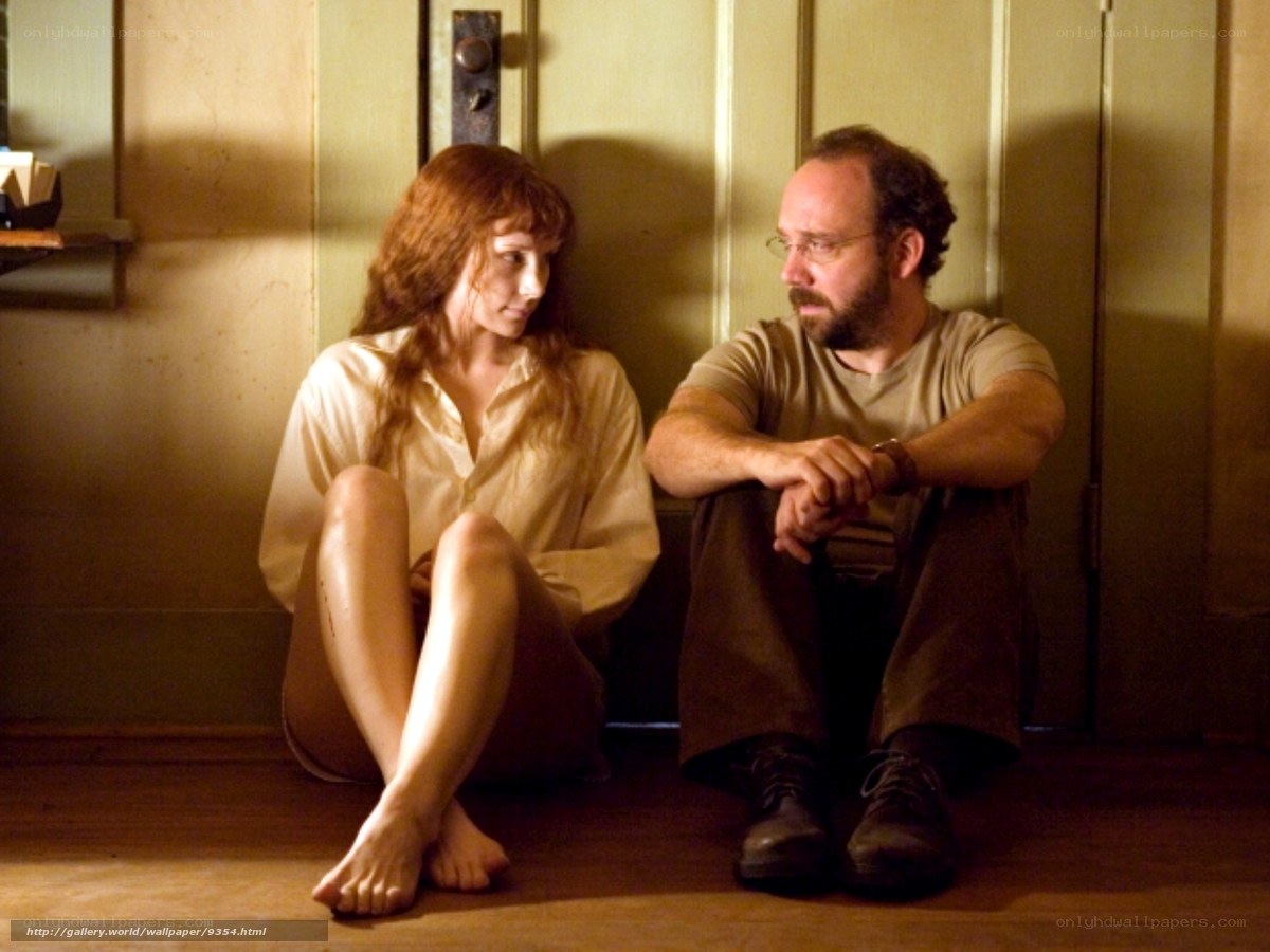man and woman sitting on floor