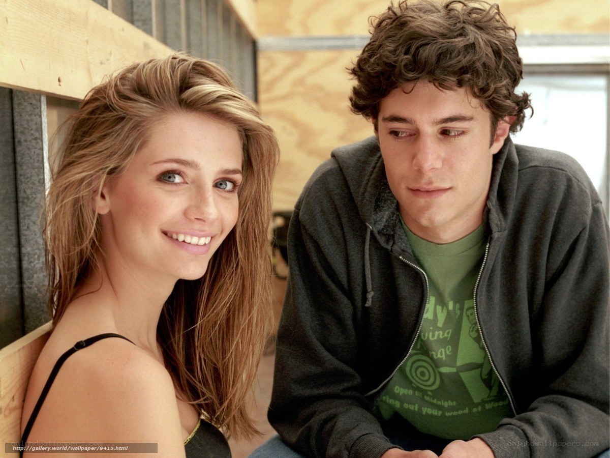man and woman sitting together