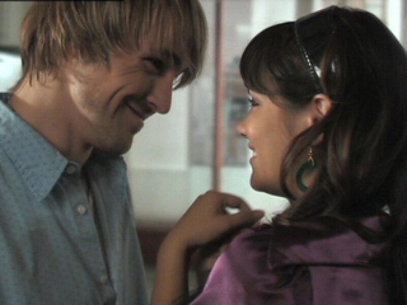 man and woman smiling at each other