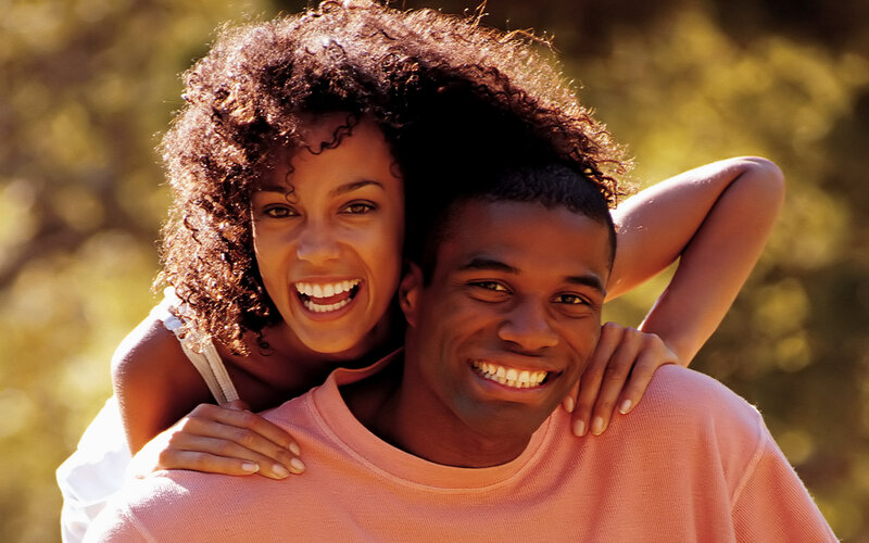 Man and Woman Smiling — Brown