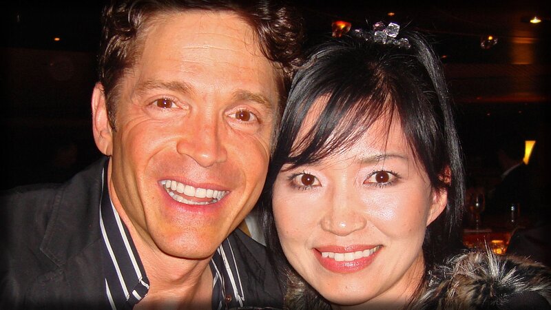 man and woman smiling together
