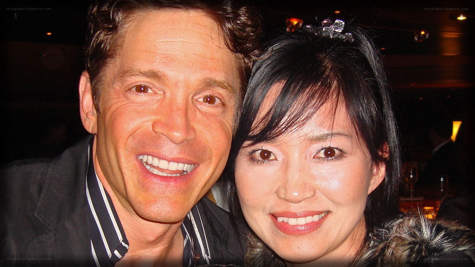 man and woman smiling together