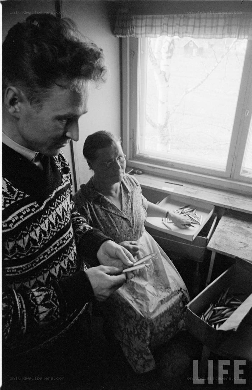 Man and woman sorting fish