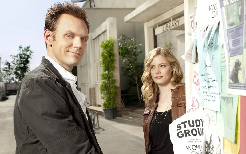 man and woman standing outside library