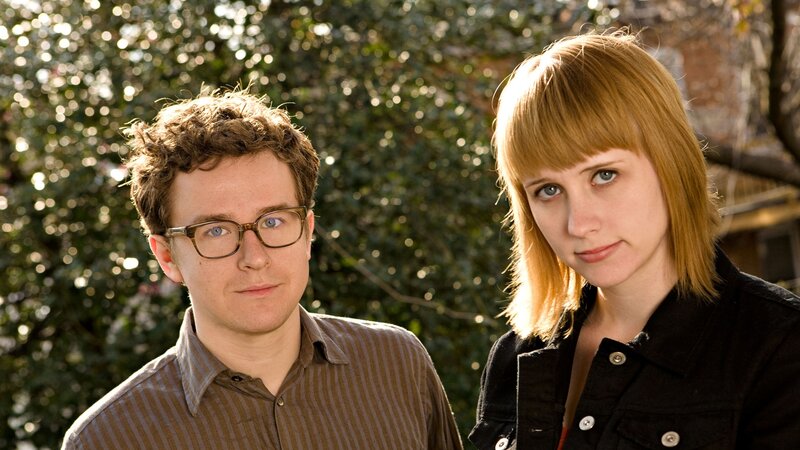 man and woman standing together