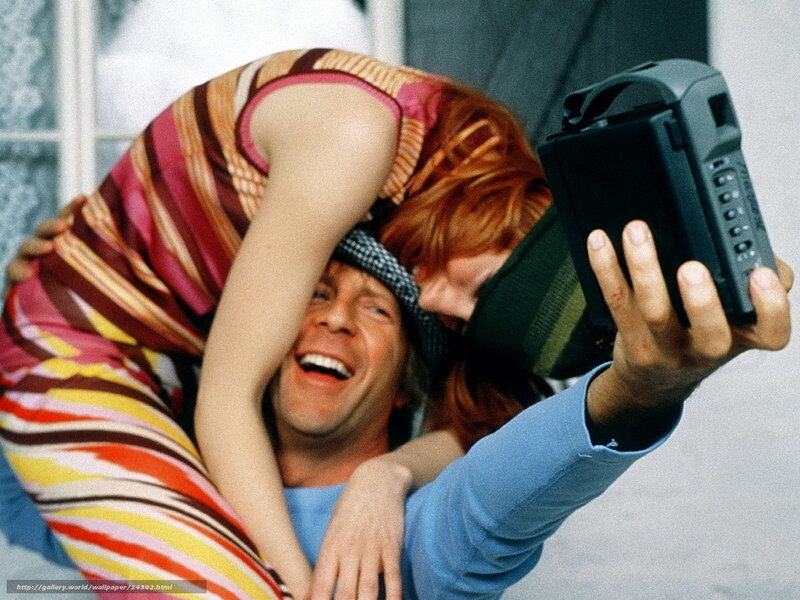 man and woman taking selfie