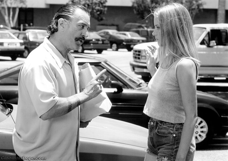Man and woman talking in parking lot