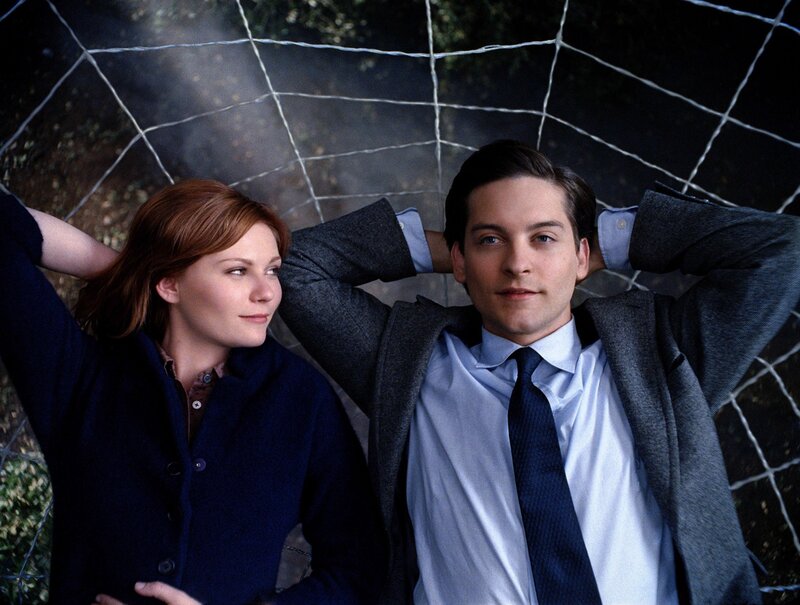 Man and woman under net
